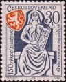 Аллегория: женщина с дощечкой, на которой указан год основания музея. Герб Праги