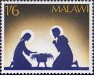 Мария и Иосиф на коленях рядом с кроваткой
