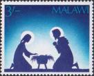 Мария и Иосиф на коленях рядом с кроваткой