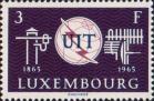 Эмблема ITU, телеграфный столб, антенны