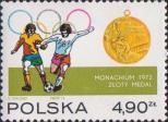 Момент игры на фоне олимпийский колец, золотая медаль XX Олимпийских игр в Мюнхене