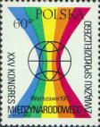 Условное изображение земного шара на фоне фигуры в цветах радуги